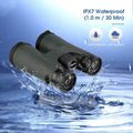 The waterproof binoculars hovering above water while it splashes on them. The binoculars have a IPX7 waterproof rating.